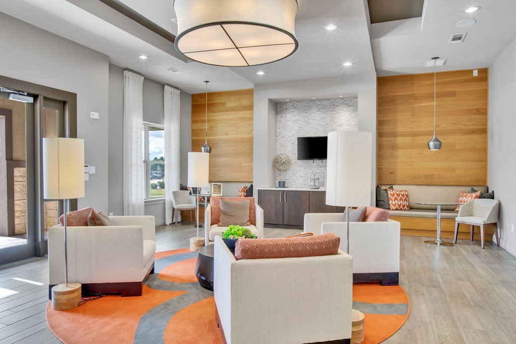 a living room with couches and chairs