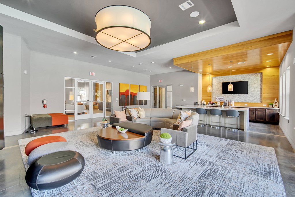 a living room with couches and chairs and a fireplace