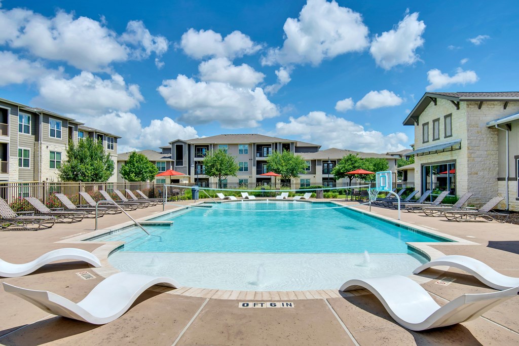 our apartments offer a swimming pool with chaise lounge chairs