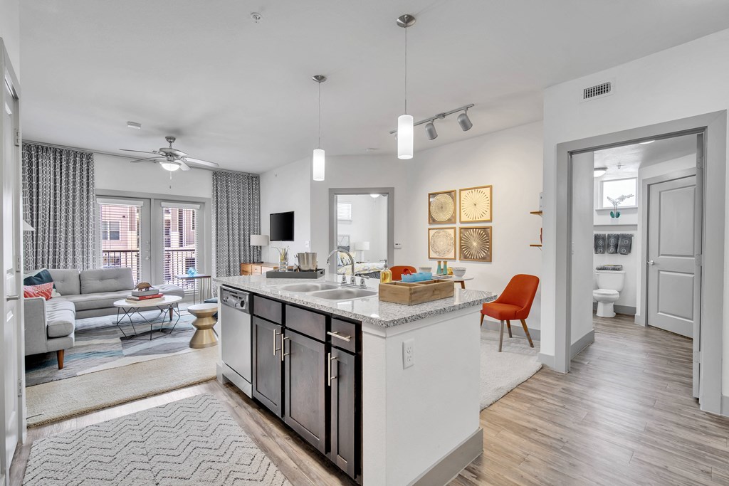 a spacious living room and kitchen with an open floor plan