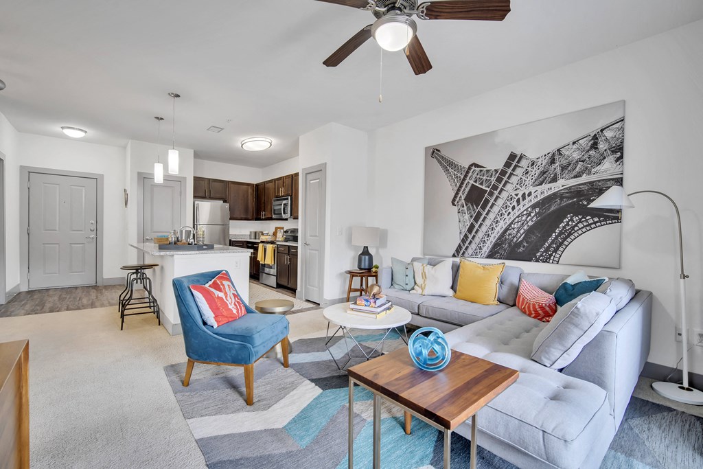 an open living room and kitchen with a couch and a table