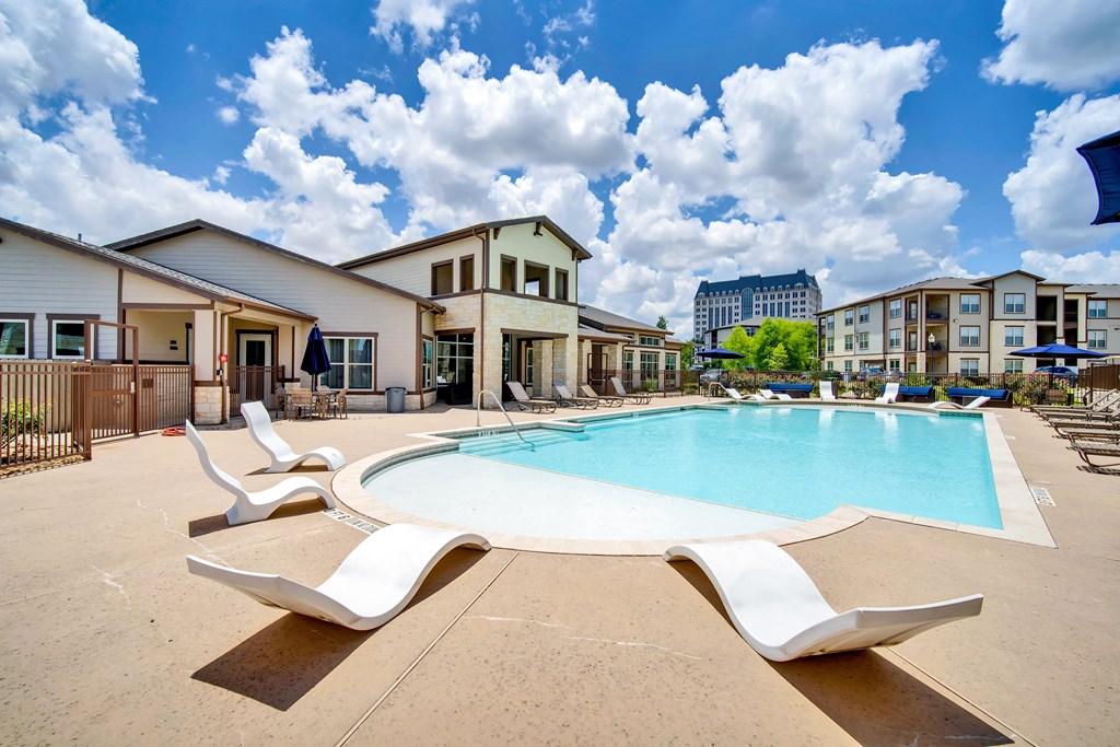 our apartments have a large swimming pool with lounge chairs