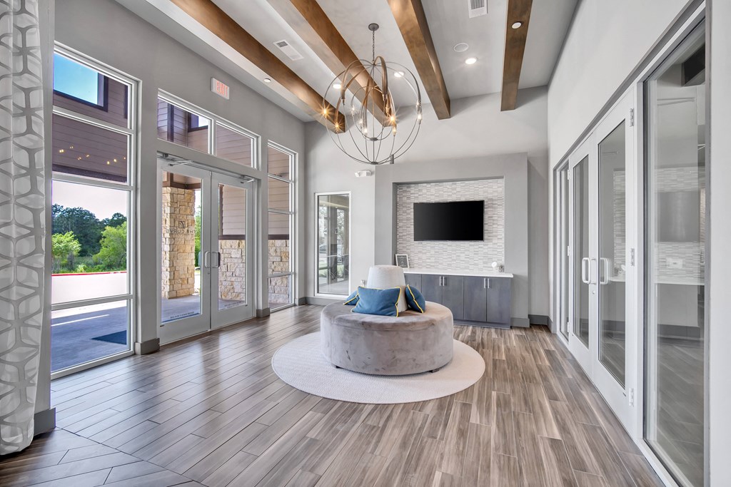 a living room with a fireplace and sliding glass doors
