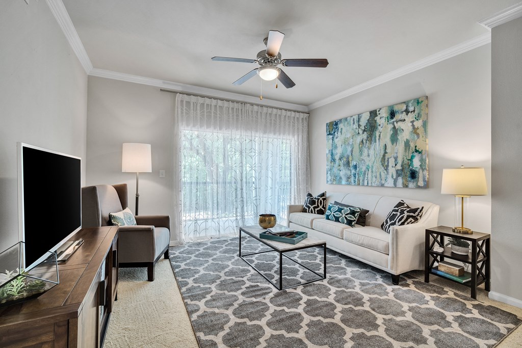 a living room with a couch and a tv