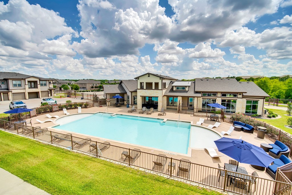 the preserve at ballantyne commons pool and resort style buildings with umbrellas