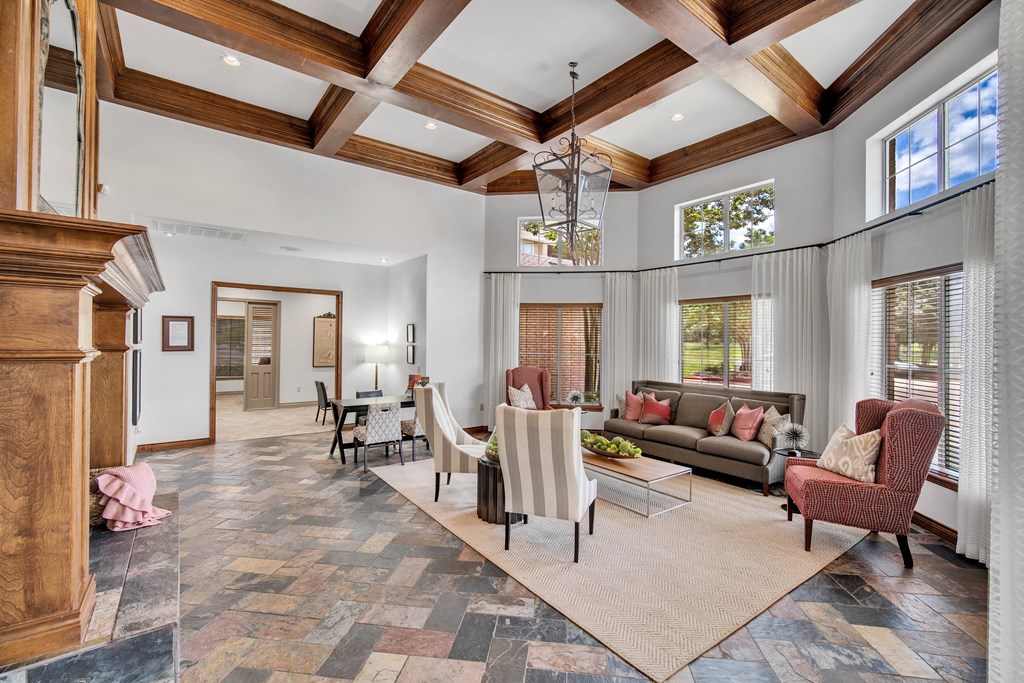 a living room with couches and chairs and a fireplace