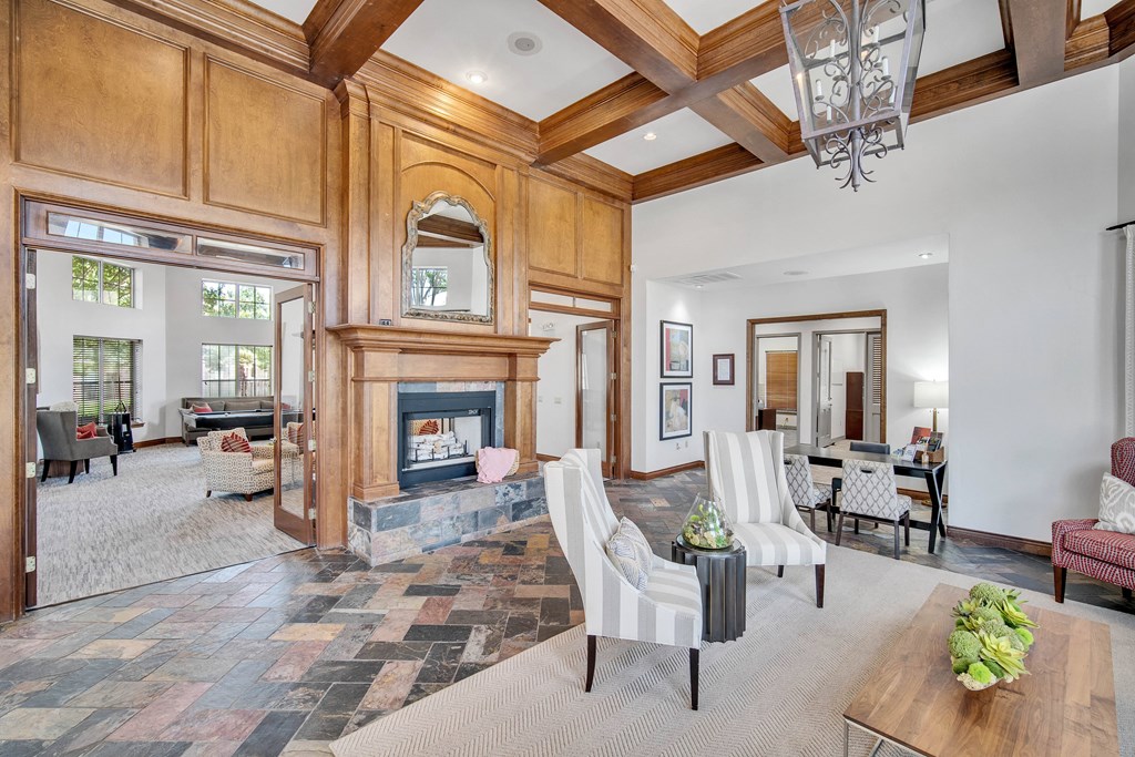 a large living room with a fireplace and furniture