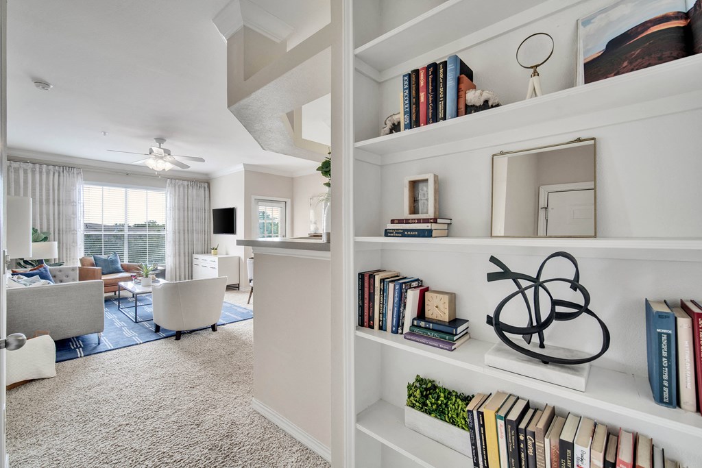living room with book shelf located in Bryan Texas at signature park apartments