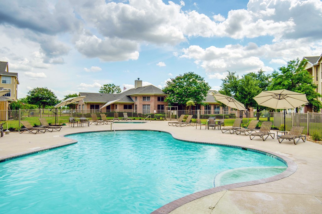 our apartments offer a swimming pool with chairs and umbrellas