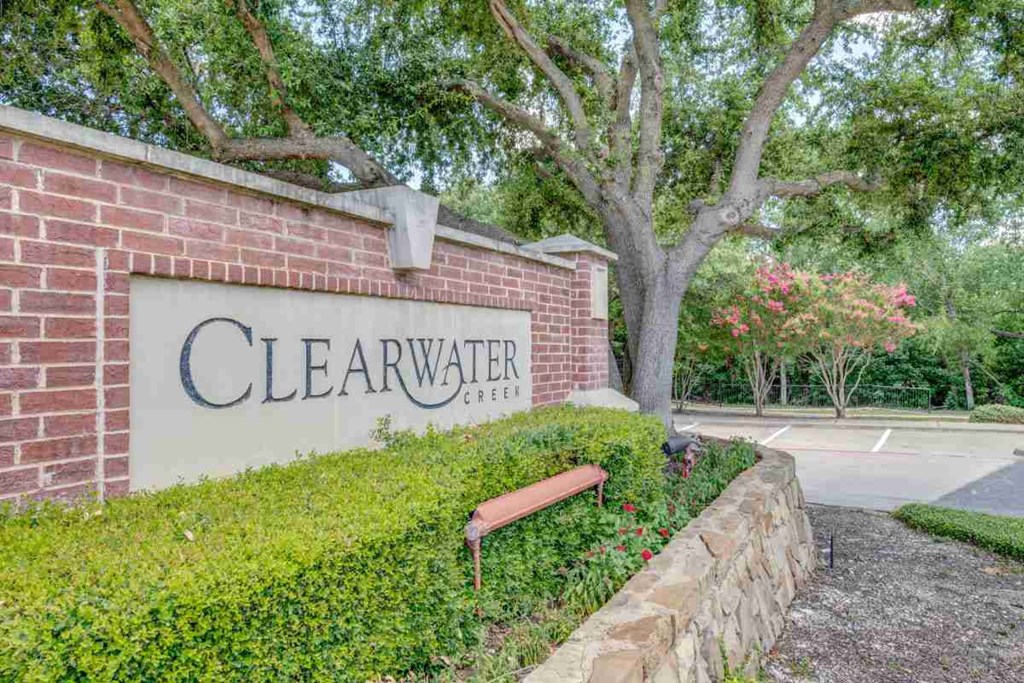 a sign for clearwater center in front of a brick wall
