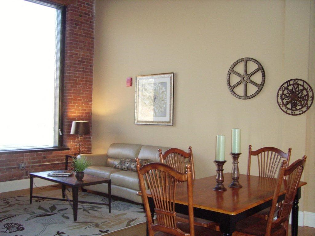 a living room with a table and a couch