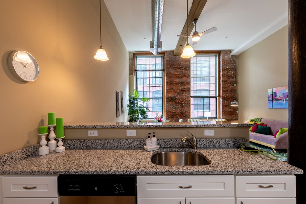 a kitchen with granite counter tops and a sink