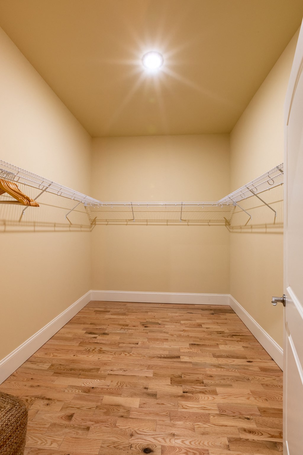 an empty room with a closet with shelves