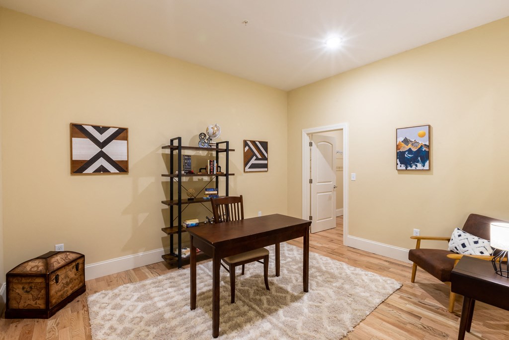 a living room with a dining room table and a couch