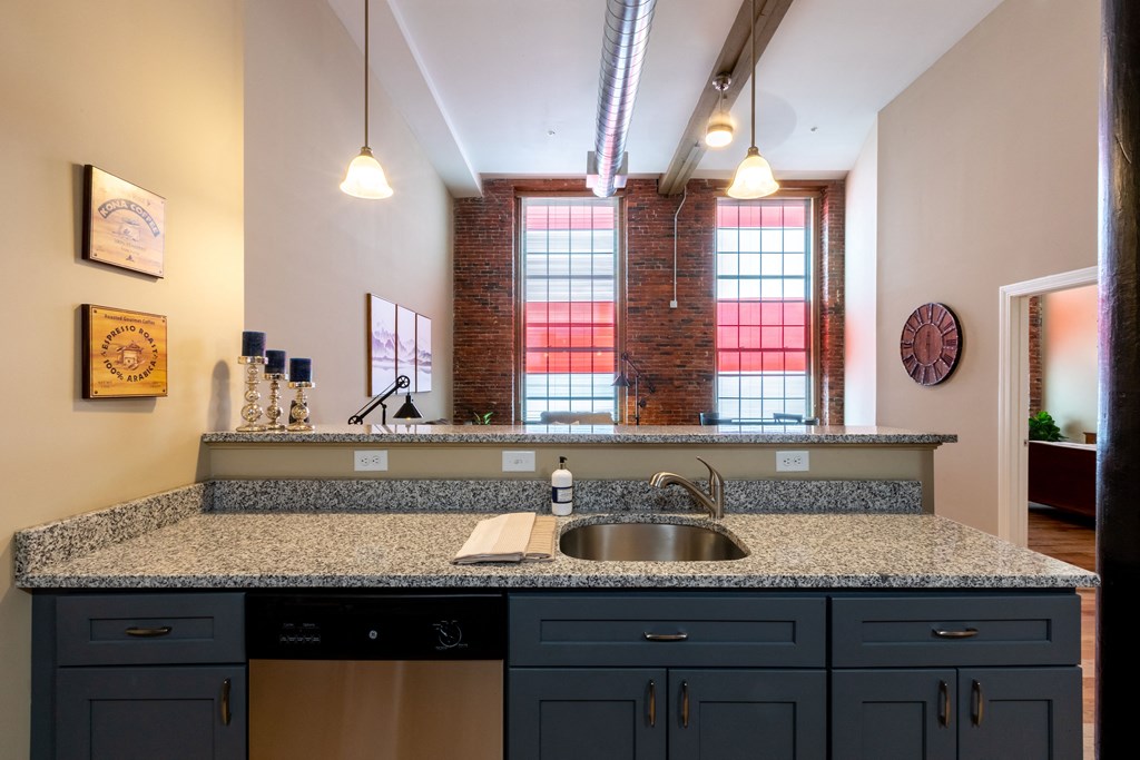 a kitchen with a granite counter top and a sink
