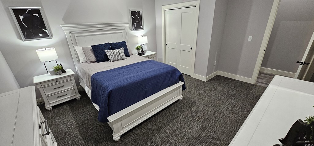 a bedroom with a bed and a closet