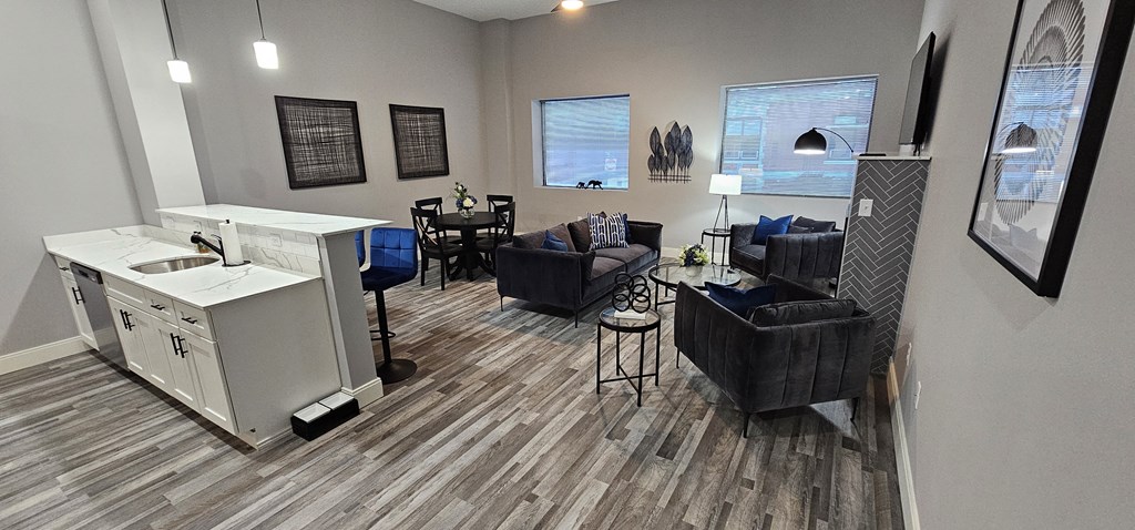 an open living room with a kitchen and a dining room