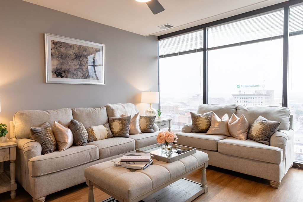 A living room with a large couch and a coffee table.