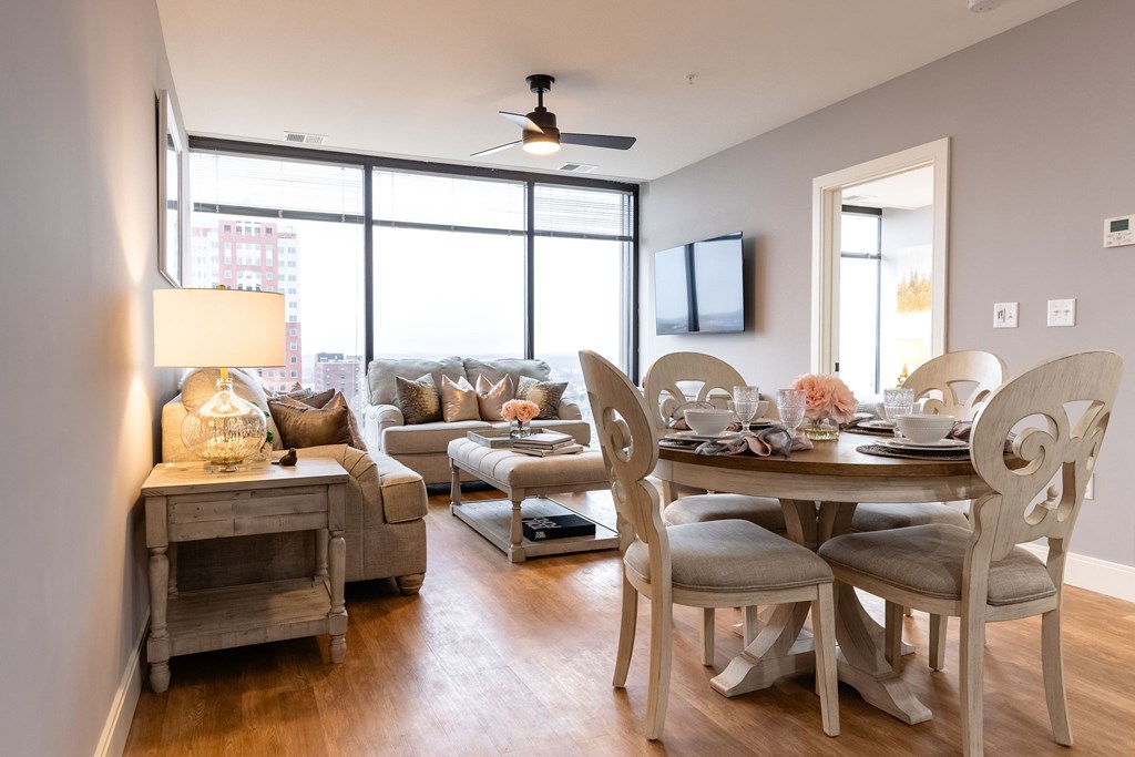 A well-lit dining area with a table set for four.