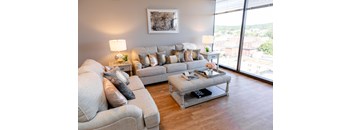 a living room with couches and a coffee table