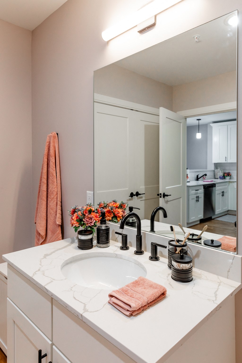 a bathroom with a sink and a mirror