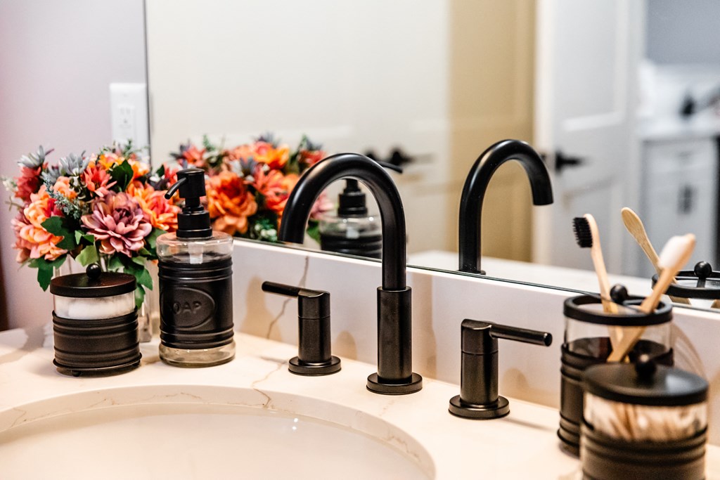 a bathroom sink with a black faucet