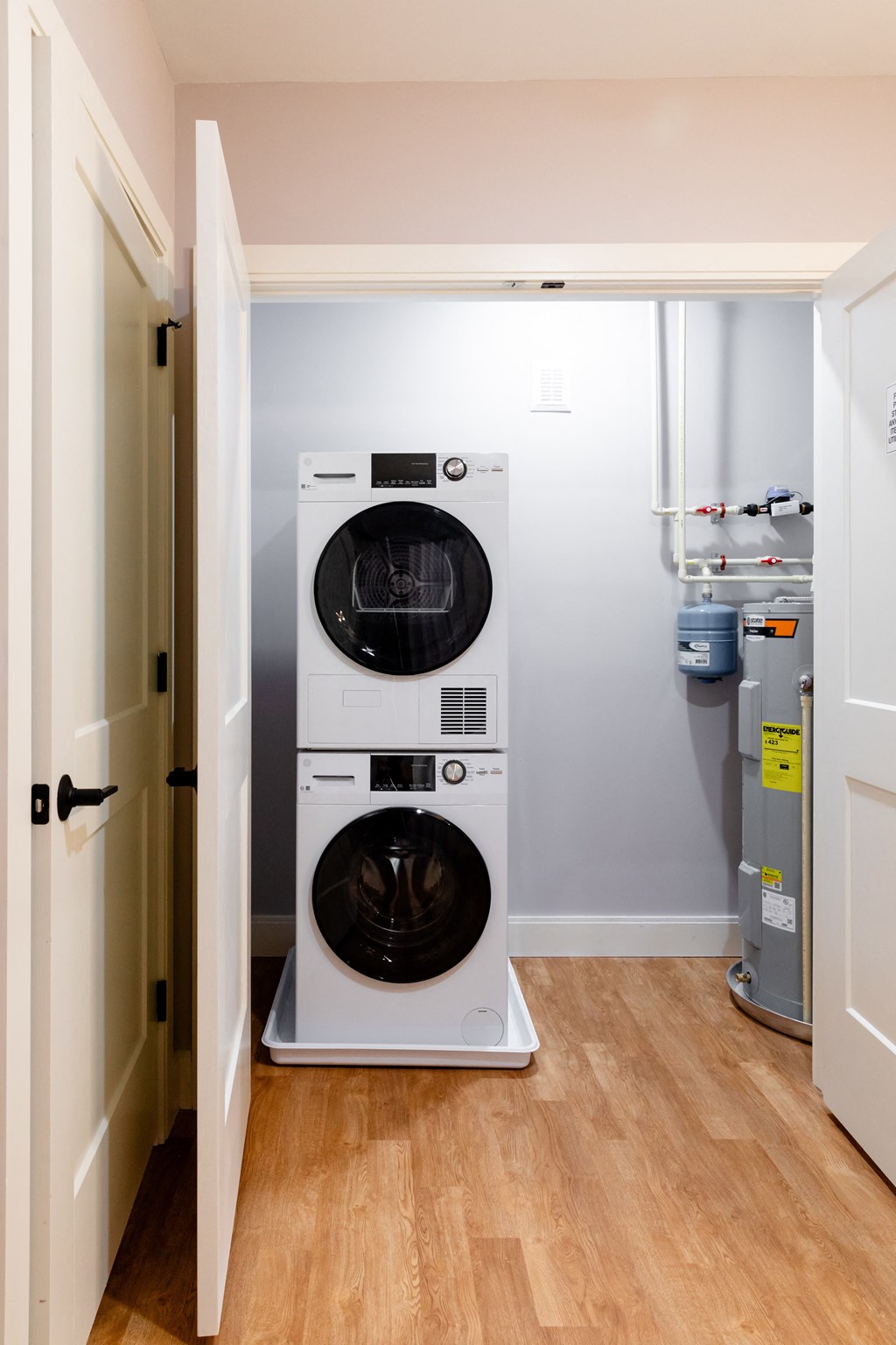 a washer and dryer in a small laundry room