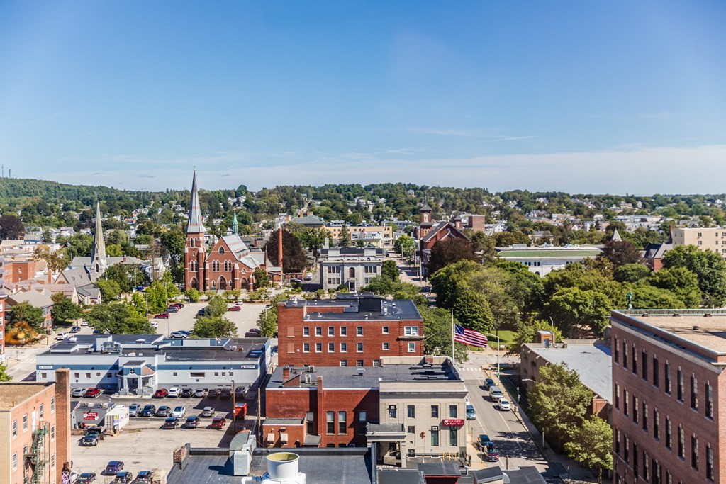 arial view of a small town with a church in the background
