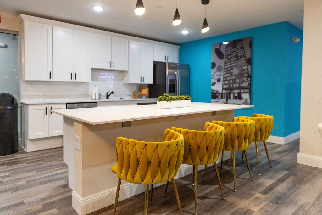 the preserve at ballantyne commons community kitchen and bar with yellow chairs