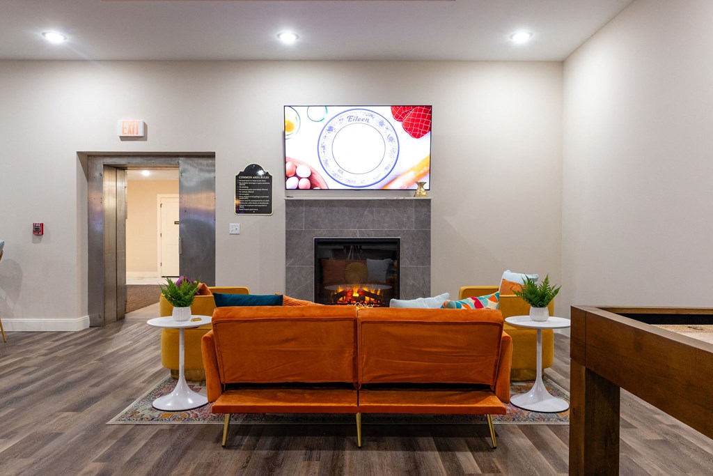 a living room with a couch and a fireplace