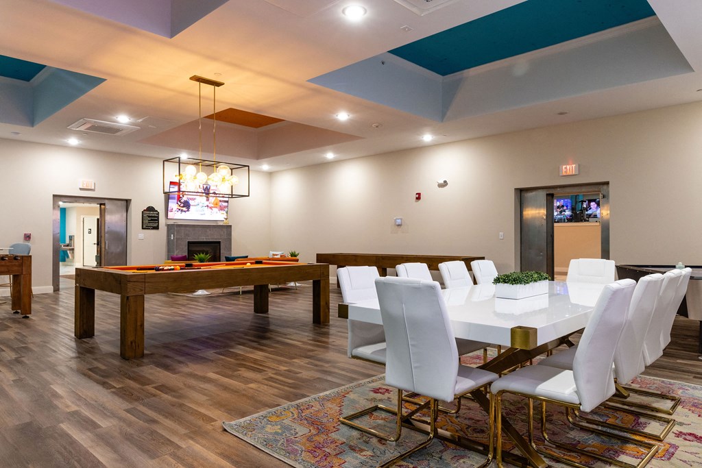 the preserve at ballantyne commons clubhouse with a pool table and dining room