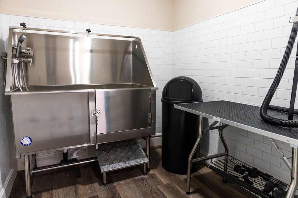 a kitchen with a large stainless steel refrigerator and a table