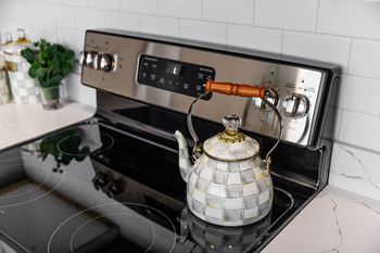 A stove top with a kettle on it.