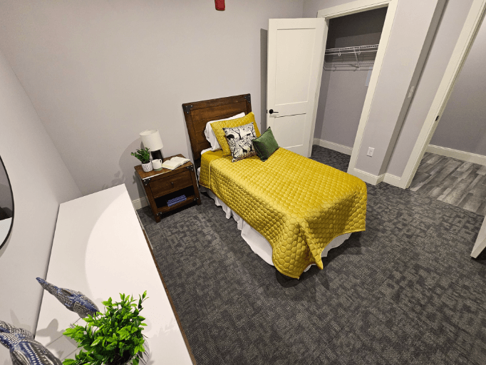 an overhead view of a bedroom with a yellow bed