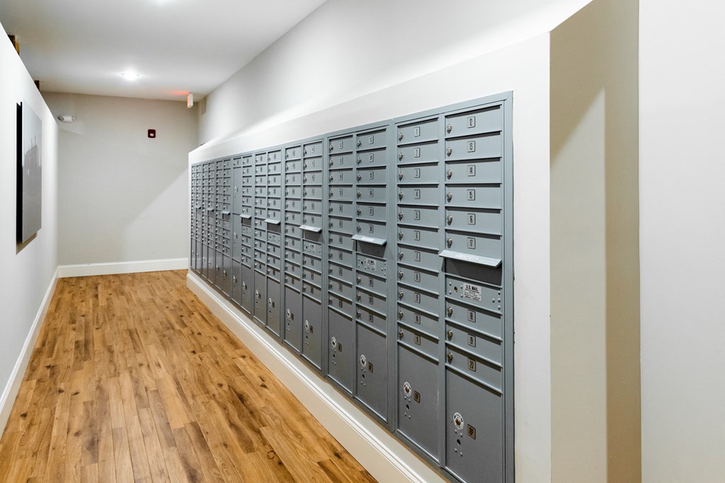 a lockers room in a building with wood floors