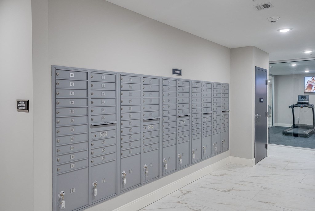 a lockers in a room with a marble floor
