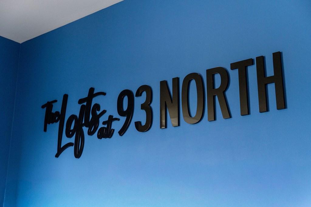 A blue wall with a sign that says "Flights 93 North".