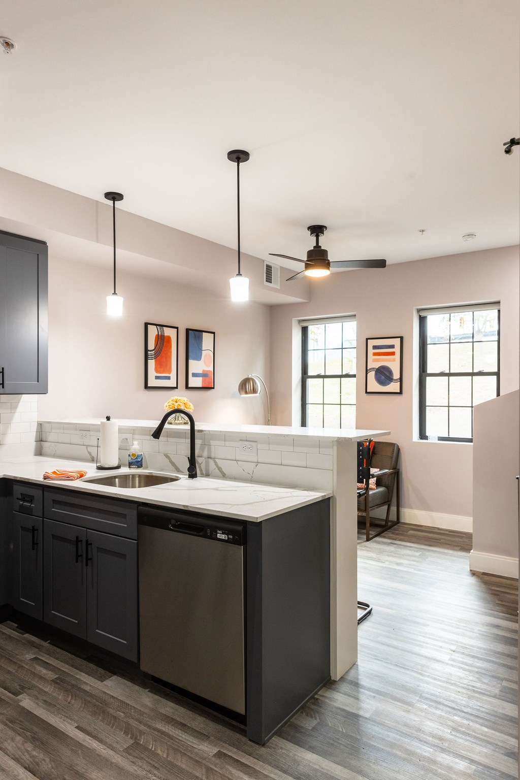 A kitchen with a sink and a window.
