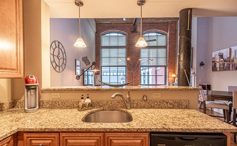 a kitchen with a granite counter top and a sink