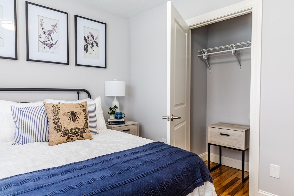 a bedroom with a bed and two night stands