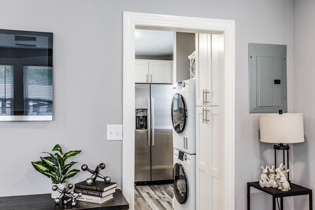 a small laundry room with a washer and dryer