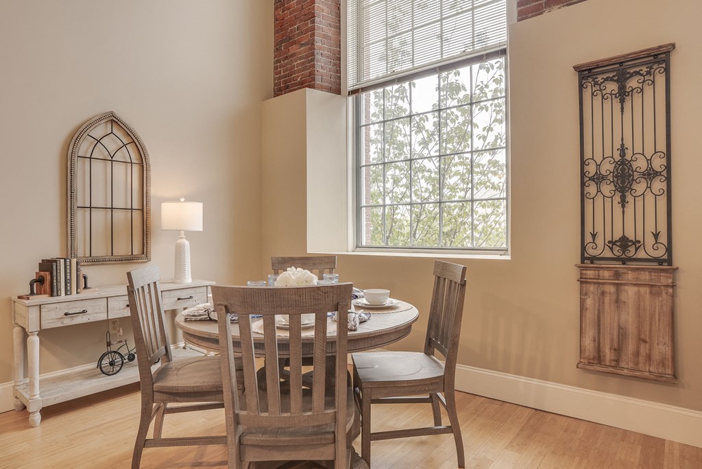 a dining room with a table and chairs