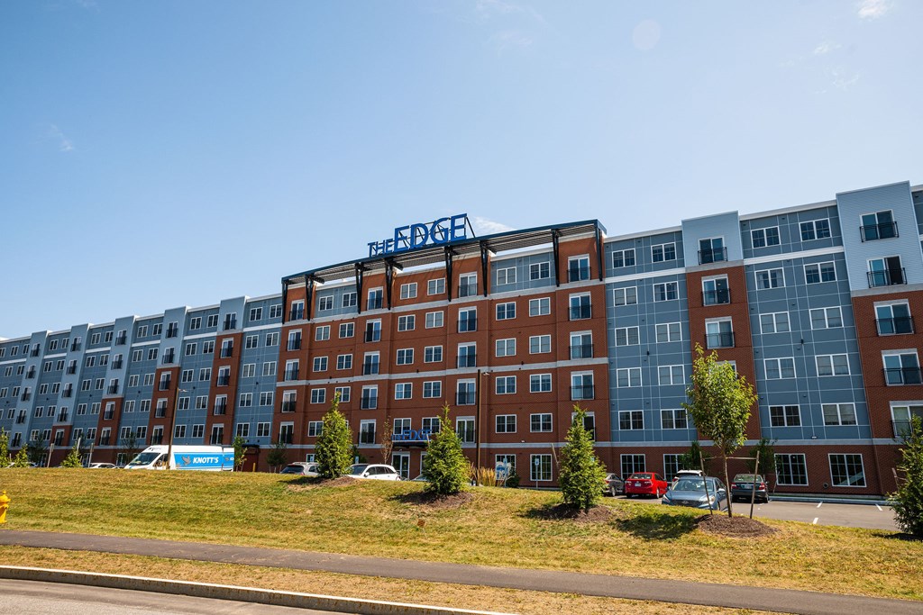 The Edge apartment building is a multi-story structure with a mix of brick and glass facades.