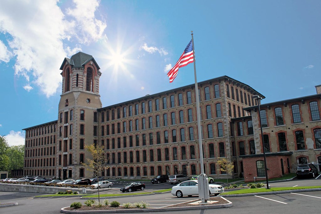 a large building with an flag in front of it