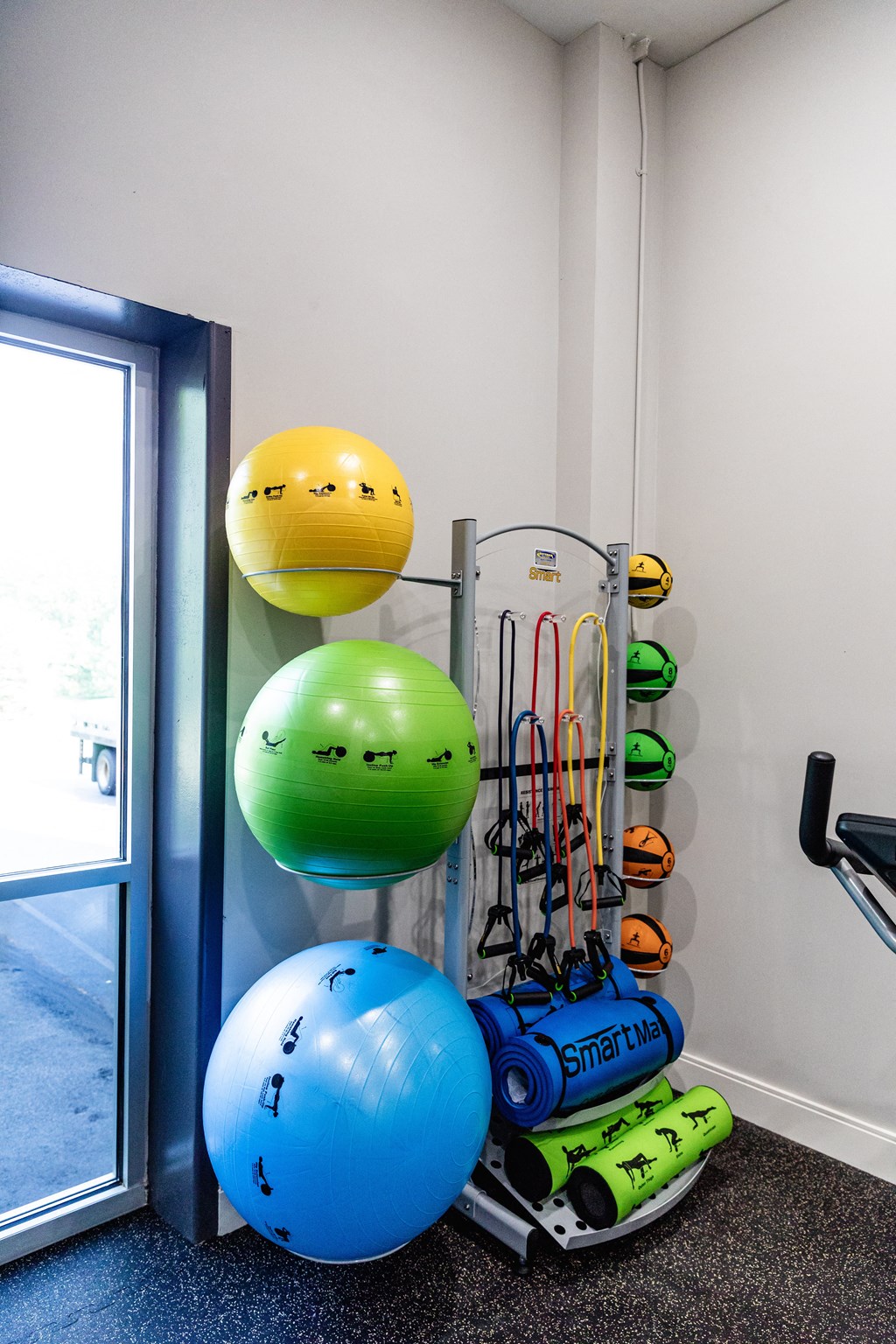 a workout room with a variety of exercise equipment