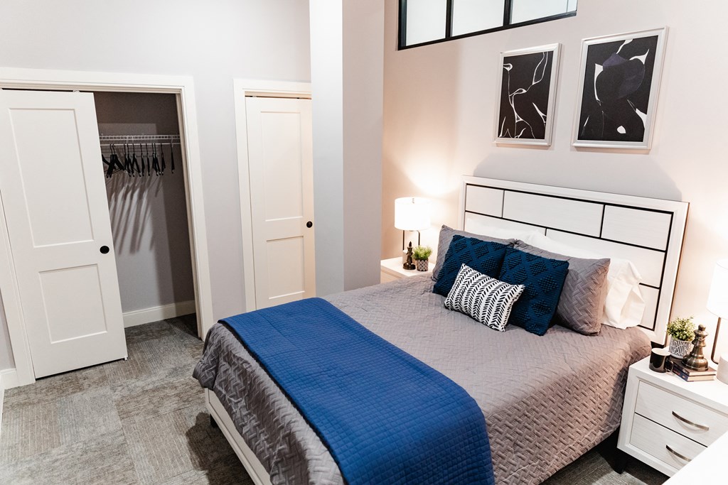 a bedroom with a bed and a closet