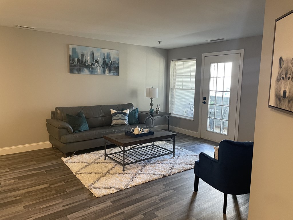 a living room with a couch and a table