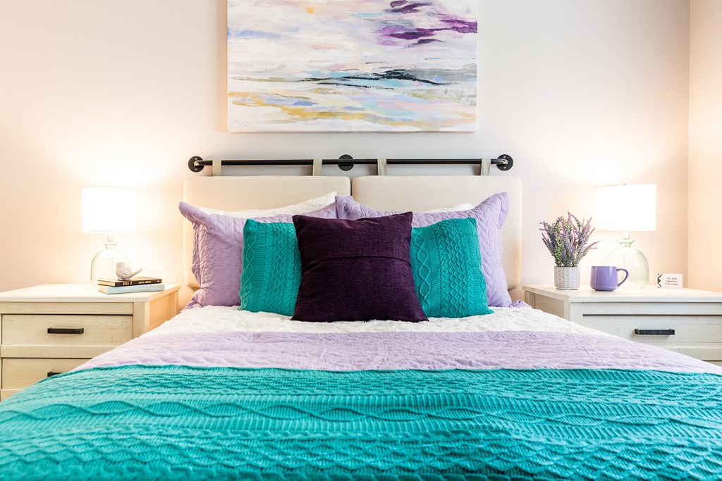 a bedroom with a bed and two night stands