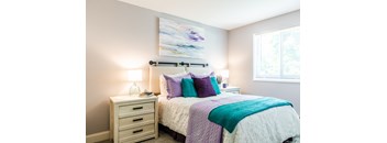 a bedroom with a bed and two night stands