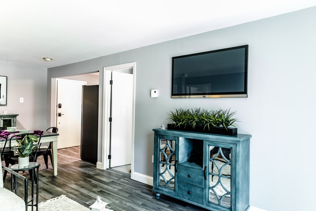 a living room with a tv on the wall